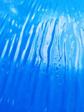 Abstract Blue Plastic Texture With Flowing Wave Pattern 写真素材