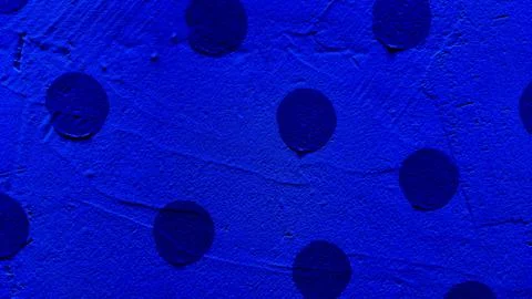 Abstract blue polka dot texture with scattered dark circles on gritty surfa.. Stock Photos