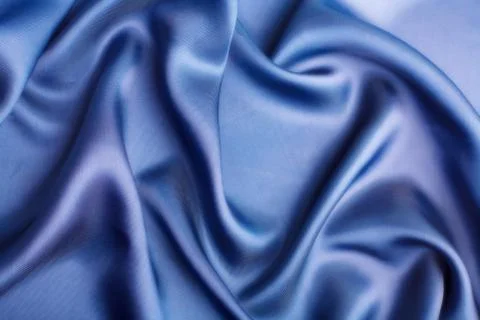 Abstract blue silk background Stock Photos