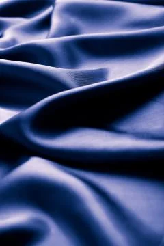 Abstract blue silk background Stock Photos