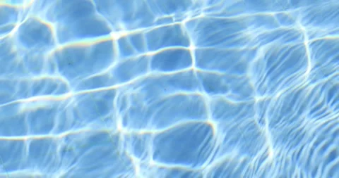 Abstract blue swimming pool water with shimmering light reflections and ripples Stock Footage 330631483
