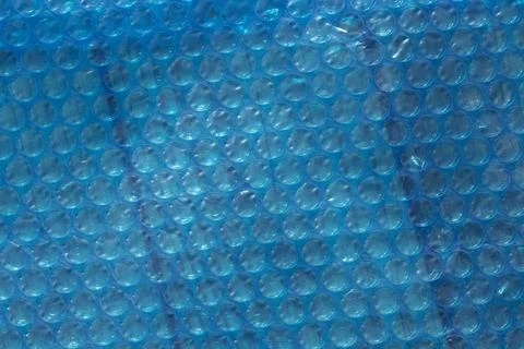 Abstract blue texture with a bubble wrap pattern. The surface features a series Foto stock