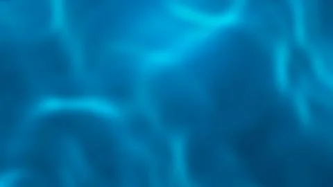 Abstract blue water background with caustics light patterns shimmering unde.. Stock Photos