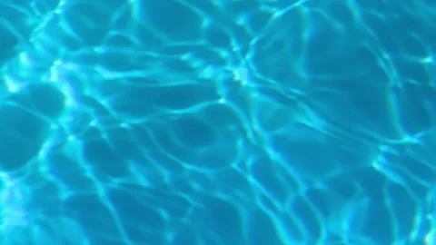 Abstract blue water reflections dancing across swimming pool surface Stock Footage 337537345