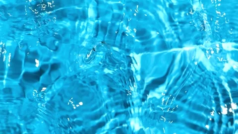 Abstract blue water surface background with gentle waves and copy space in slow  Stock Footage 345657007