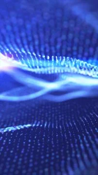 Abstract blue wave of glowing digital particles creating a futuristic sense.. Illustrazione stock
