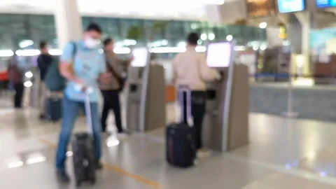 Abstract blur and unfocused motion of people using self service machines Stock Footage 247105401