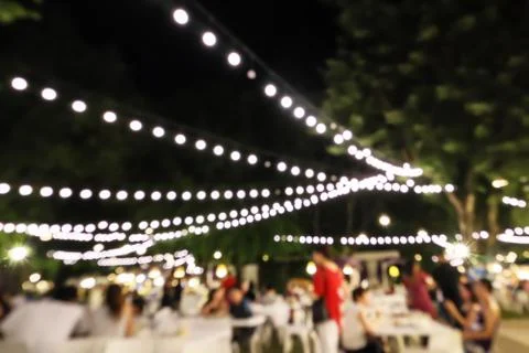 Abstract blur background of authentic local lifestyle summer night party. Stock Photos