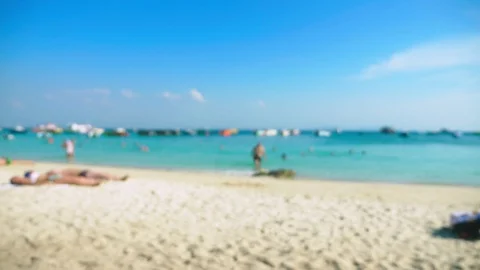 Abstract blur background of beach on island , resting people and boats Stock Footage 100277690