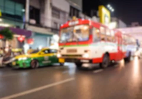 Abstract blur background Buses and taxis on Yaowarat Road at night. Stock Photos