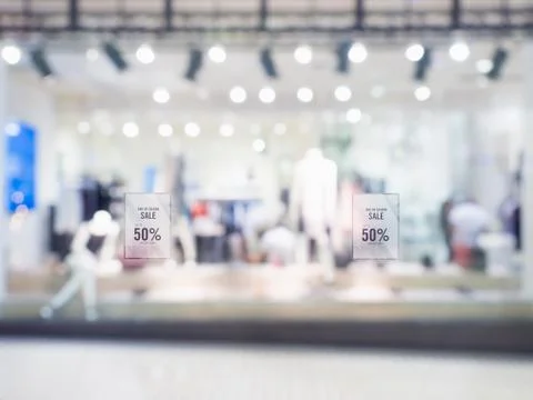 Abstract blur background display of women clothing shop in shopping mall with Stock Photos