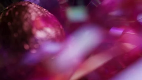 Abstract blur of colorful metallic Easter eggs and grass Stock Footage 327910099