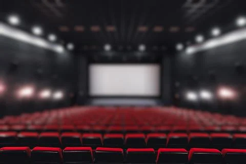 Abstract blur Empty rows of red theater or movie seats. Chairs in cinema hall Stock Photos