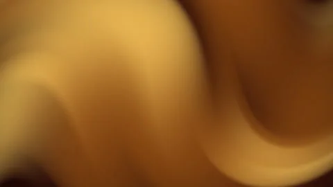 Abstract blur featuring a mix of brown and yellow tones Stockbeeldmateriaal 309924610