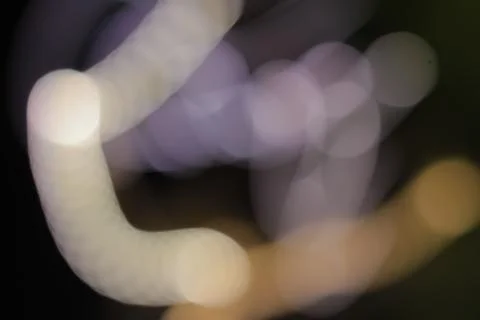 Abstract blur of light trails with a slow shutter speed creating ethereal pat Stock Photos