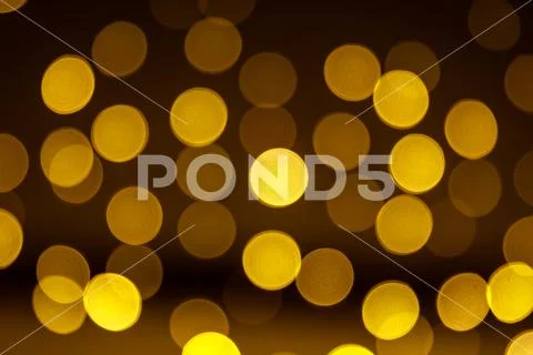 Abstract blur yellow sparkle bokeh background. Blurred defocused lights in Stock Photos