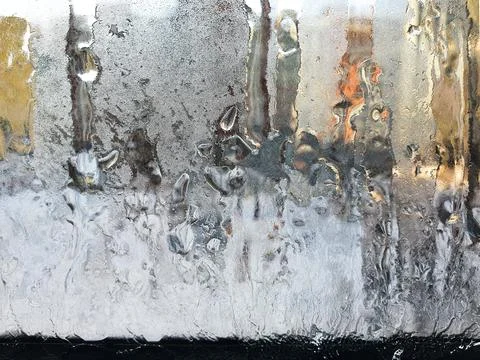 Abstract blurred background, beautiful patterns are drawn by frost on balcony Stock Photos