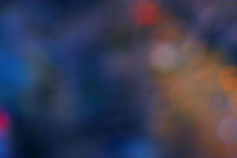 Abstract blurred background with bokeh effect in blue and orange tones Stock Photos