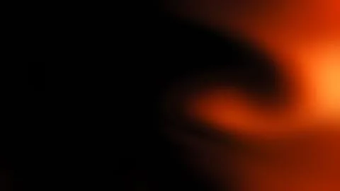 Abstract blurred background, with deep black, and glowing orange. Stock Photos