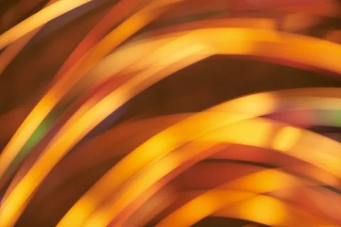 Abstract blurred background, dynamic design, yellow and orange lights in moti Stock Photos