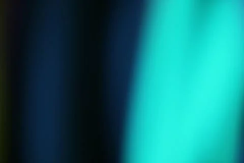 Abstract blurred background featuring a dynamic teal and navy gradient Stock Photos