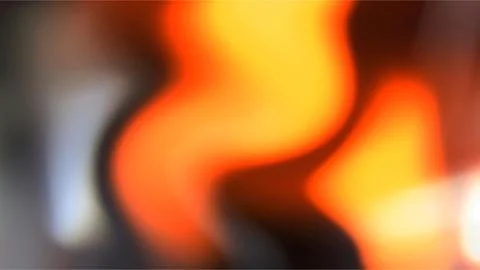 Abstract blurred background, with glowing orange, yellow, and red waves Illustrazione stock