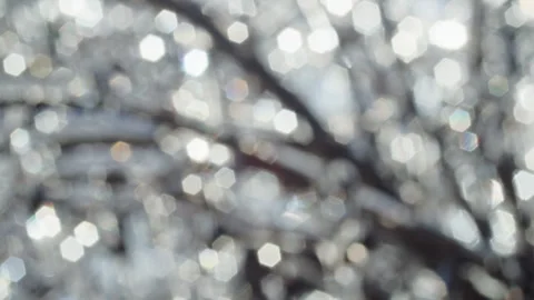 Abstract blurred background with hexagonal bokeh light reflections on frozen Stock Footage 303666171