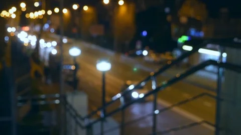 Abstract blurred background. night city with steel railings near the city road Stock Footage 106523500