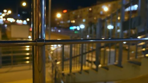 Abstract blurred background. night city with steel railings near the city road Stock-Footage 106528633