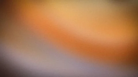 Abstract blurred background with orange beige and brown gradient grainy tex.. Stock Photos