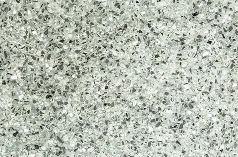 Abstract blurred background of small pebbles in white and gray Stock-Fotos