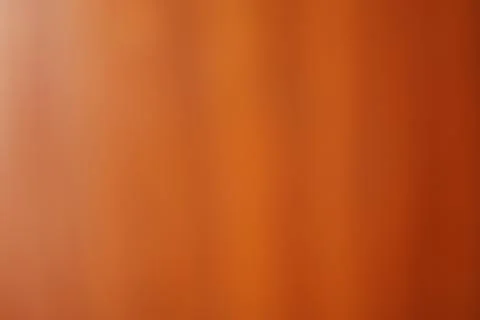 Abstract blurred background with smooth gradient of warm orange and brown ton Stock Photos