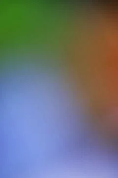 Abstract blurred background with smooth transitions of green blue and orange Stock Photos
