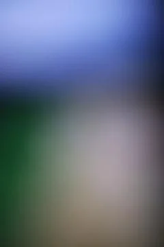 Abstract blurred background with soft blue and green gradient light texture. Stock Photos