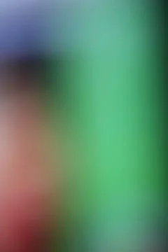 Abstract blurred background with soft gradient transitions in green and red.. Stock Photos