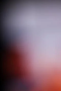 Abstract blurred background with soft gradient transitions of purple and or.. Stock Photos