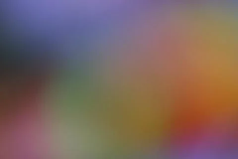 Abstract blurred background with soft gradient of purple orange and green Stock Photos