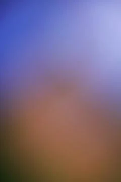 Abstract blurred background with soft gradient of blue and warm orange tones Stock Photos