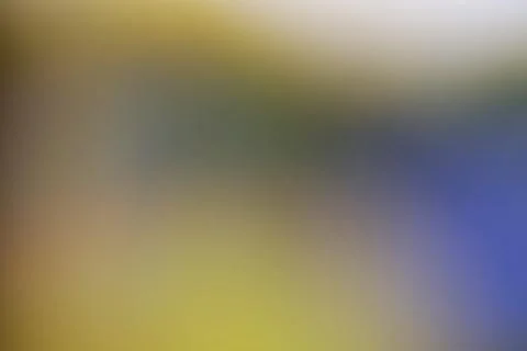 Abstract blurred background with soft gradient of yellow and blue tones Stock Photos
