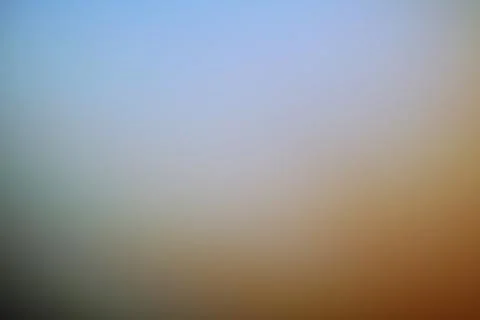 Abstract blurred background with soft gradient of blue and warm brown tones Stock Photos