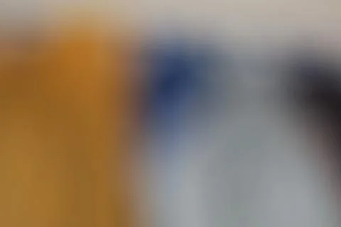 Abstract blurred background with soft gradients of orange blue and white colo Stock Photos