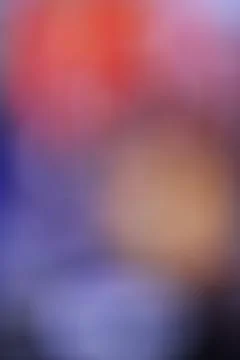 Abstract blurred background with soft gradients of purple orange and red Stock Photos