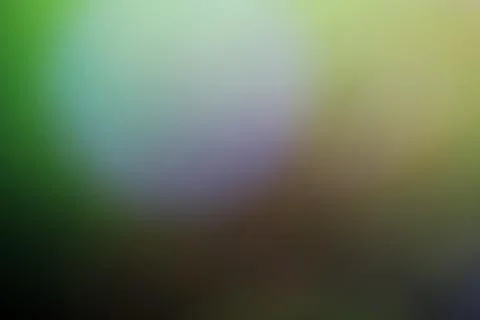 Abstract blurred background with soft green and yellow light gradients Stock Photos