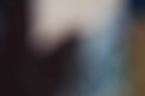 Abstract blurred background with soft light gradients and dark moody tones Stock Photos