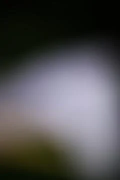 Abstract blurred background with soft light gradients and dark edges Stock Photos