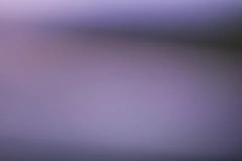 Abstract blurred background with soft purple and dark grey gradient tones Stock Photos