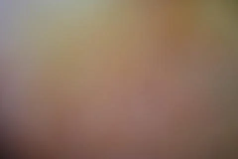 Abstract blurred background with soft warm brown and beige gradient tones Stock Photos