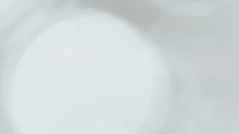 Abstract blurred background with soft white circles and light reflections 스톡 일러스트