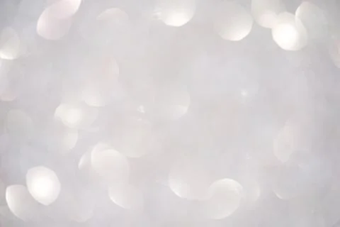 Abstract blurred background with soft white bokeh lights creating a dreamy .. Stockfoto's
