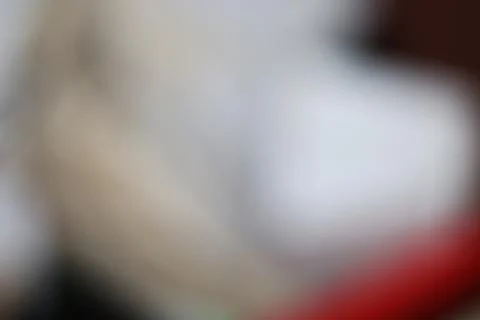 Abstract blurred background with soft white and red light gradients. Stock Photos